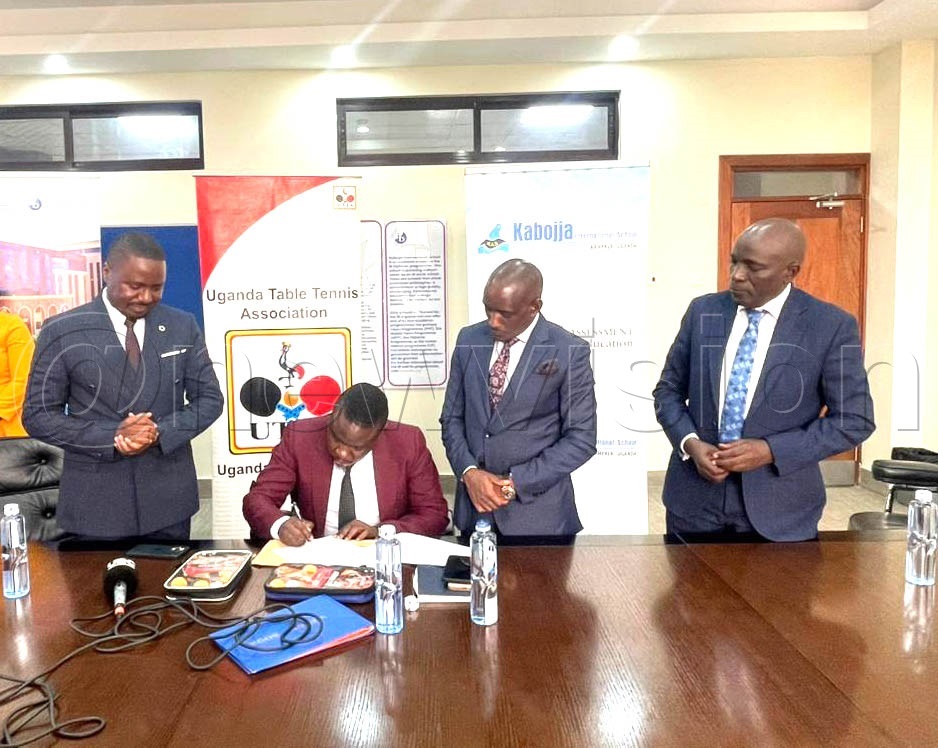 Members of the Uganda Table Tennis Association and Kabojja International School interact during the signing of a Memorandum of Understanding