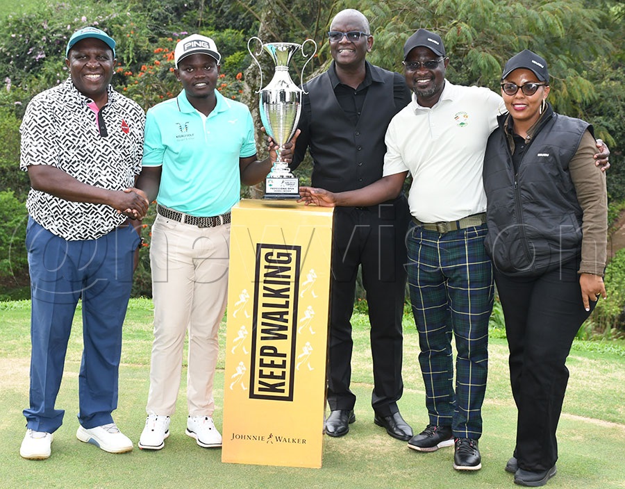 Rwandan Celestine Nsanzuwera (2nd left)  poses with UBL Chairman Jimmy Mugerwa (left), UBL MD Anthony Kilonzo (center), UGU president Jackson Were and ISUZU's Senior Sales Manager Margaret Murangi (right) after he won the Johnnie Walker Uganda Golf Open Professionals championship at the Lugazi Hills Golf and Country Club. Photo by Michael Nsubuga