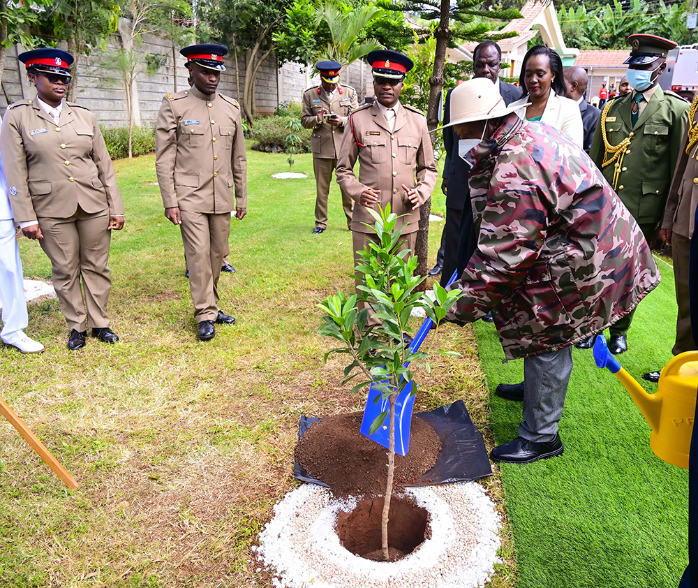 President Museveni plants a tree seedling at the National Defence College of Kenya in Nairobi on Thursday shortly after giving a lecture of opportunity to officers undergoing a military course.