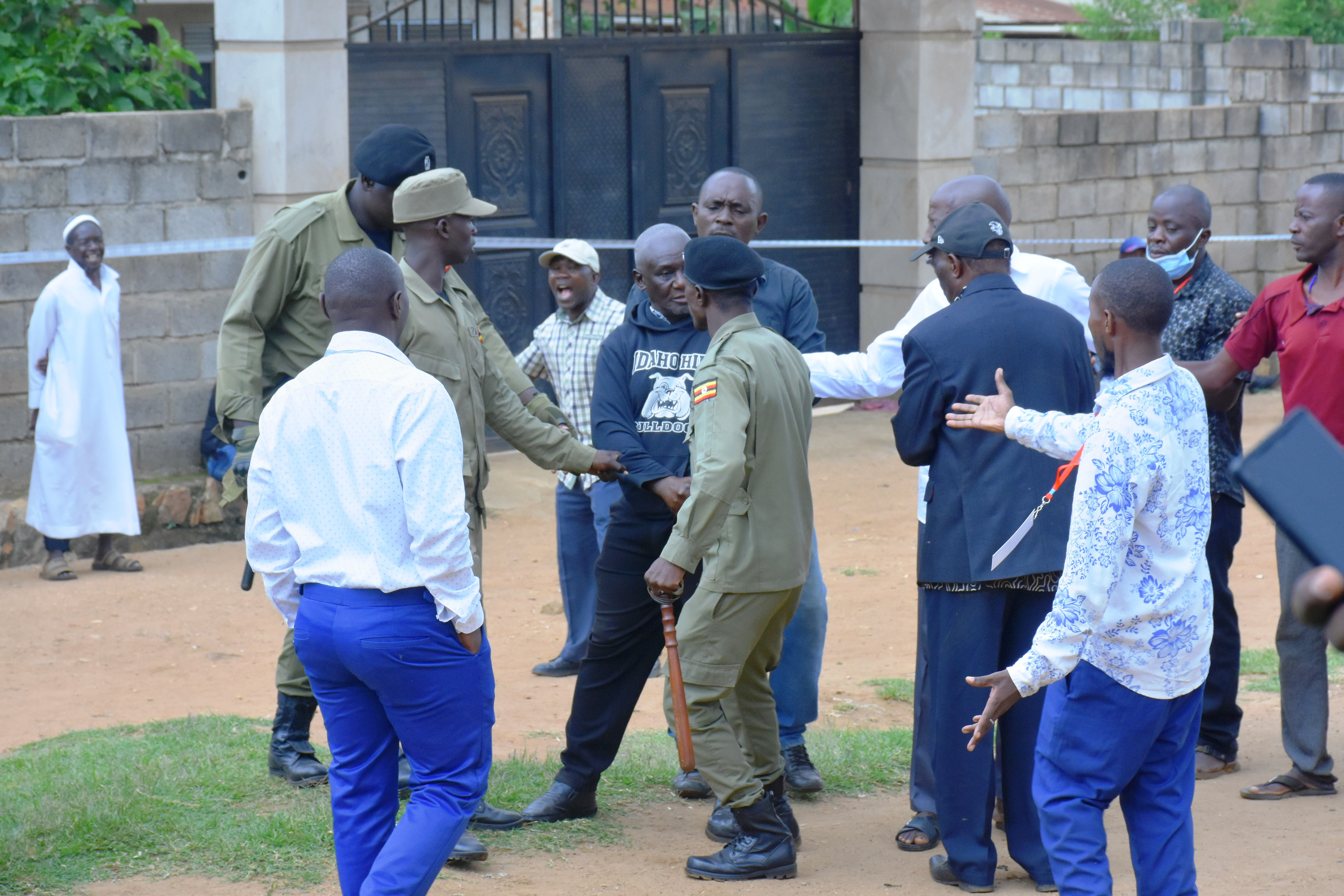 Police officers dragging out a man from the electoral area where the voting was intended to take place