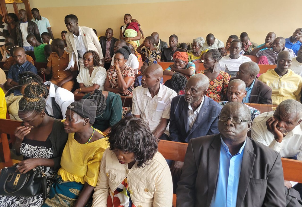 Zedriga's family members listen to court proceedings during the hearing of their relative's case. (Credit: Christopher Nyeko)