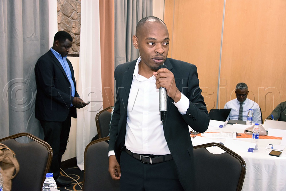 Gideon Nsambire Atukwase, chairperson of Publish What You Pay Uganda, discussing at the meeting on extractives at Protea Hotel, Kampala. (Photo by John Odyek) 