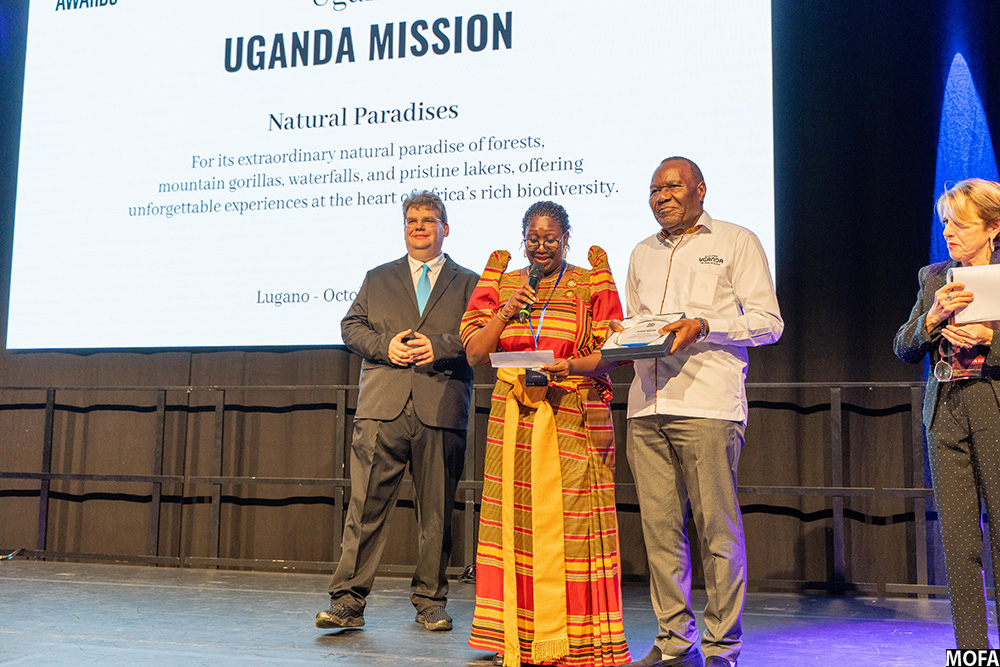 Amb. Marcel Tibaleka accompanied by Head of Public Diplomacy Margaret Kafeero receives the Swiis Tourism Award 2025 in the Natural Paradises Category