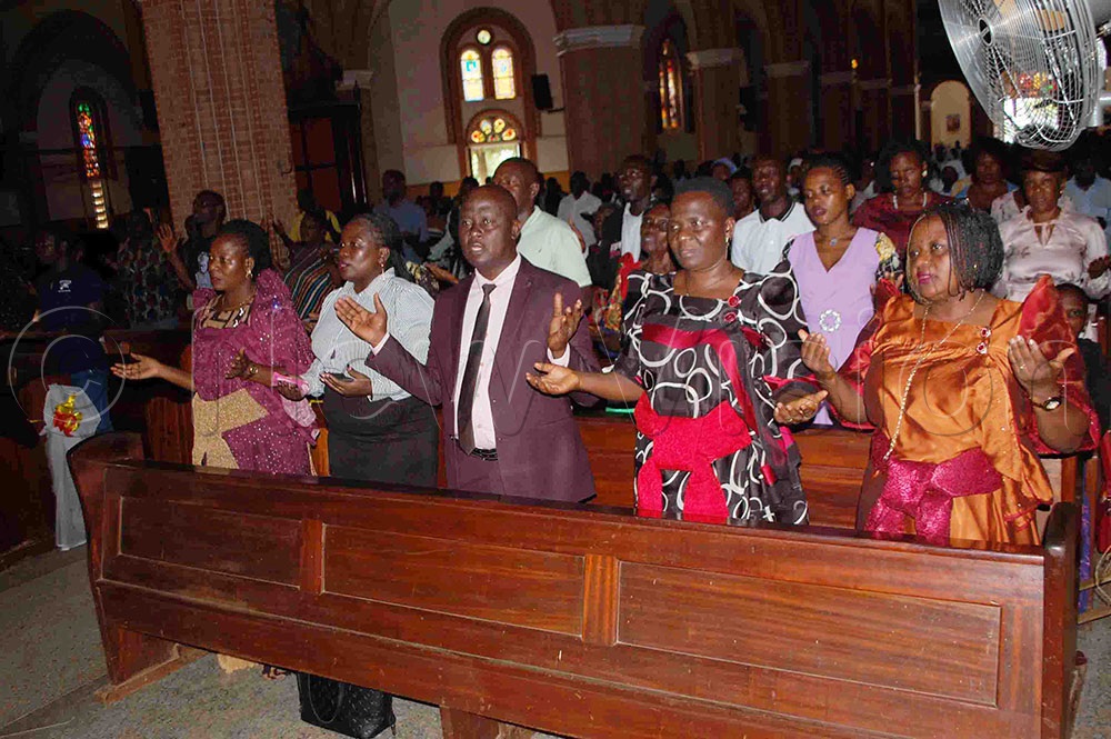 Archbishop Lwanga's family members praying with other Christians during the memorial mass for the Prelate's 3rd death anniversary at Rubaga Cathedral on Wednesday, April 3, 2024. Photo by Mathias Mazinga