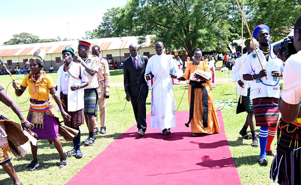 Parents taking their son Deacon Christopher Olupot to get ordained into a priest on Eastern Monday. (Credit by Delux Emmy Alomu)