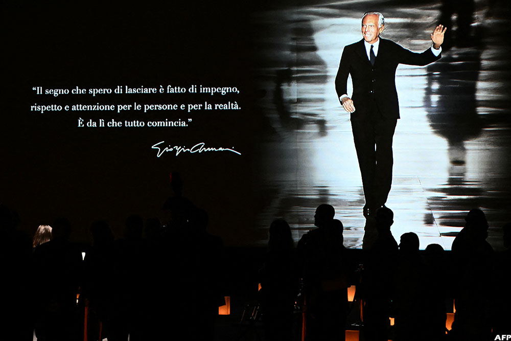 People queue to see the coffin of late Italian fashion designer Giorgio Armani lying-in state.