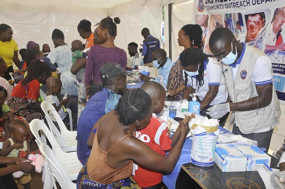 Children being treated during the medical camp organised by President Spirit Ministries International from America, Dr. Michelle Corral, in memory of the late Mother Teresa's birthday with communities of Katanga slum in Kampala on August 26th. (Credit: Wilfred Sanya)