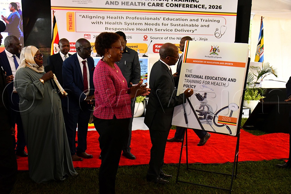  The Minister of Higher Education John Chrysostom Muyingo (right) launching the National Education and Training for Health Policy 2025 at the 4th National Health Professionals' Education and Training for Healthcare Conference at Source of the Nile Hotel in Jinja City on April 29th.  Looking on is the Minister of Health Dr. Jane Ruth Aceng (middle) and the Commissioner of Health Education and Training at the Ministry of Education and Sports Hajati Dr. Safina Museene (left). (Photo by Donald Kiirya)