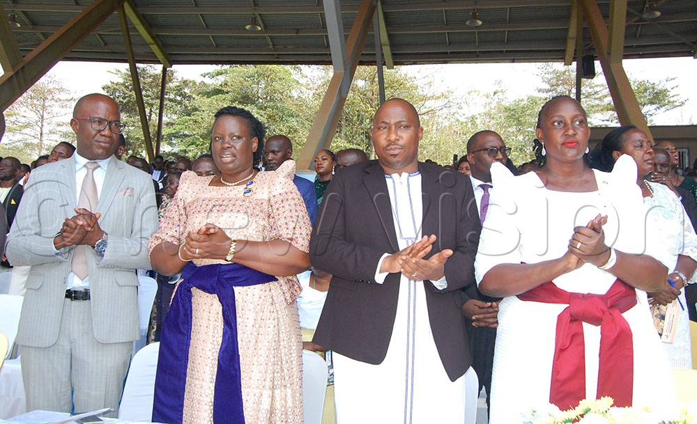 Wakiso District Woman MP Betty Ethel Naluyima (right), her husband, Engineer Tadius Nsubuga (second right), and other Catholic couples during Mass. (Credit: Mathias Mazinga)