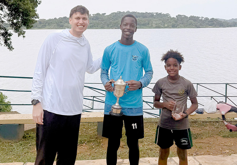Youth sailors James Mugarura (center) and Lucius Markov (right) pose with their awards for the Entebbe-to-Kaazi race. Mugarura won first place out of 20 boats, while Markov is believed to be the youngest helmsman to ever complete the event. Courtesy photo