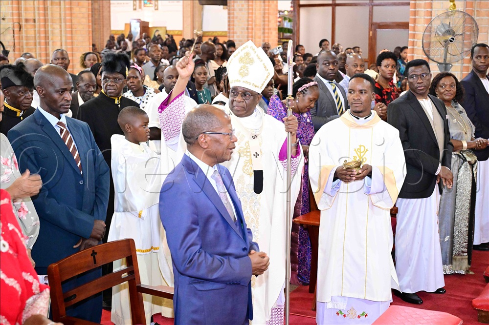 The Archbishop of Kampala His Grace Paul Ssemogerere sprinkling holy water onto Christians who turned up for the Christmas prayers at Lubaga Cathedral on Thursday, December 25, 2025.