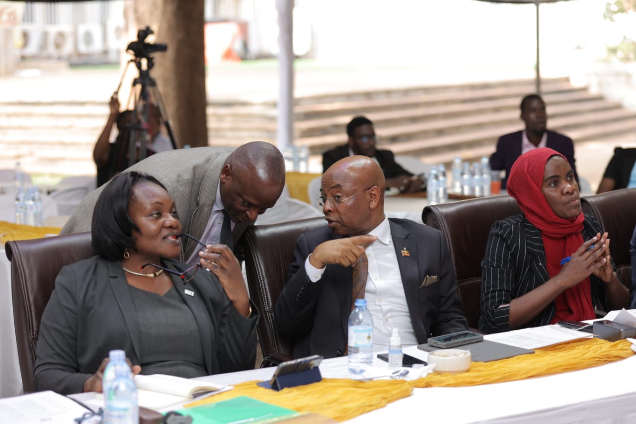 Christine Alupo (L), Director Currency, and Deputy Governor Prof. Augustus Nuwagaba (C) and judges during the competitions.