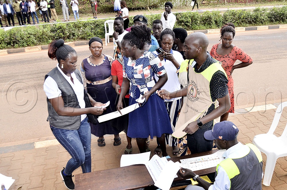 The Returning Officer for Central and Southern Region, Kayunga District Jennifer Kyobutungi (left) cross check voter&rsquo;s card for first ten voters for the kick-start of the election exercise during the subdue elections for direct LC 5 councillors for Nakawa division at Shell field polling center along Stretcher Ntinda Road next to Uganda police barracks, Kampala on March 13 2026. (Photo by Ronnie Kijjambu)
