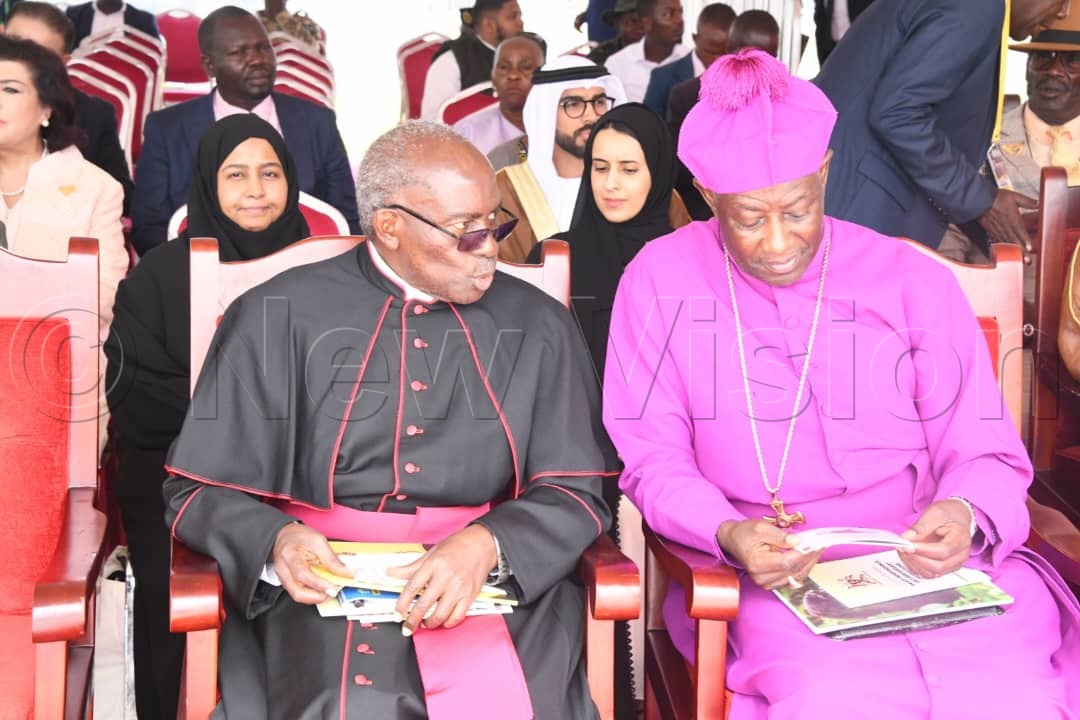 Msgr Charles Kasibante (left) and Archbishop of the Church of Uganda, Samuel Stephen Kaziimba (right).