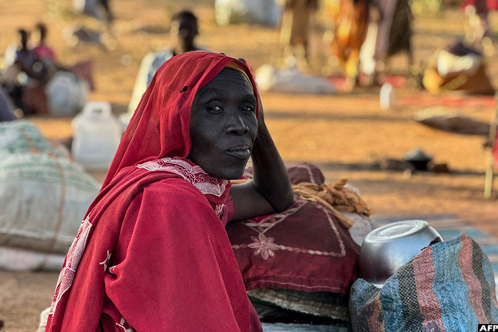 A displaced Sudanese woman rests in the town of Tawila in war-torn Sudan's western Darfur region on October 28, 2025