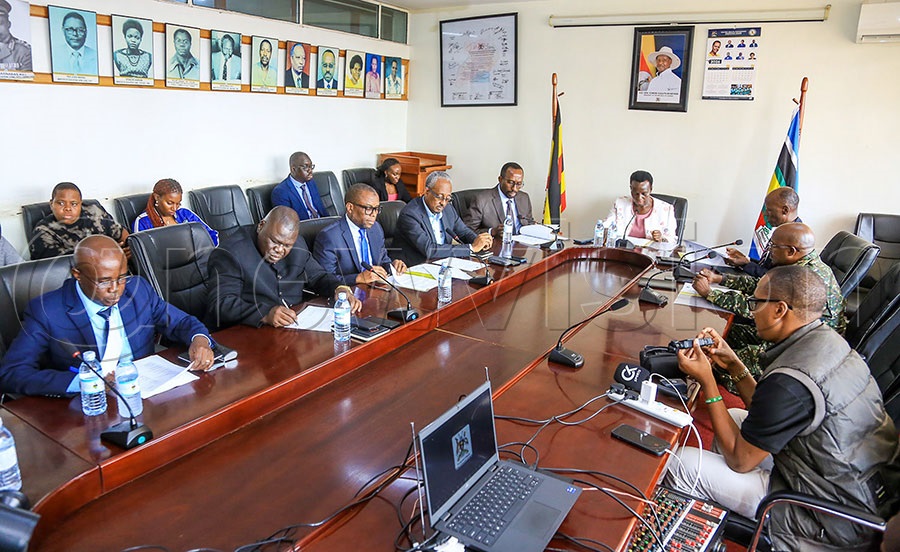Ministry of Education and Sports Permanent Secretary Kedrace Turyagyenda (centre) addresses the media about the signed Namboole Stadium MOU. Photo by Fred Kisekka
