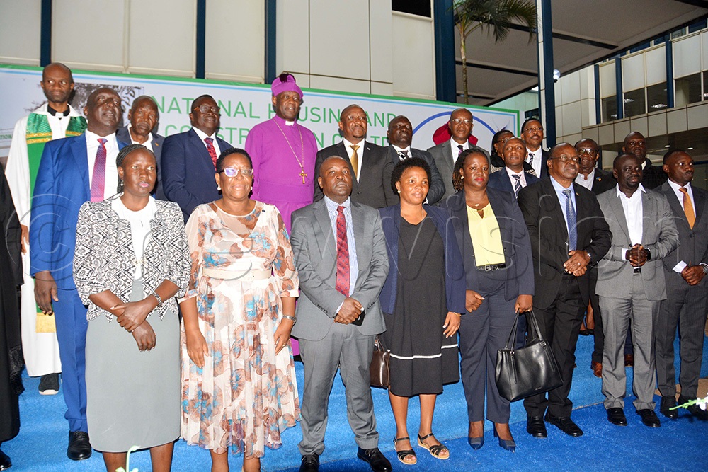  The Archbishop of Church of Uganda Dr Stephen Samuel Kaziimba (in purple robe behind row) and chief executive officer of NHCC Eng. Kenneth Kaijuka (sixth left behind row)pose for a group photograph with the top management of National Housing after the new year prayer breakfast of National Housing at Crested Towers in Kampala on Monday February 9, 2026. (Photo by Francis Emorut)