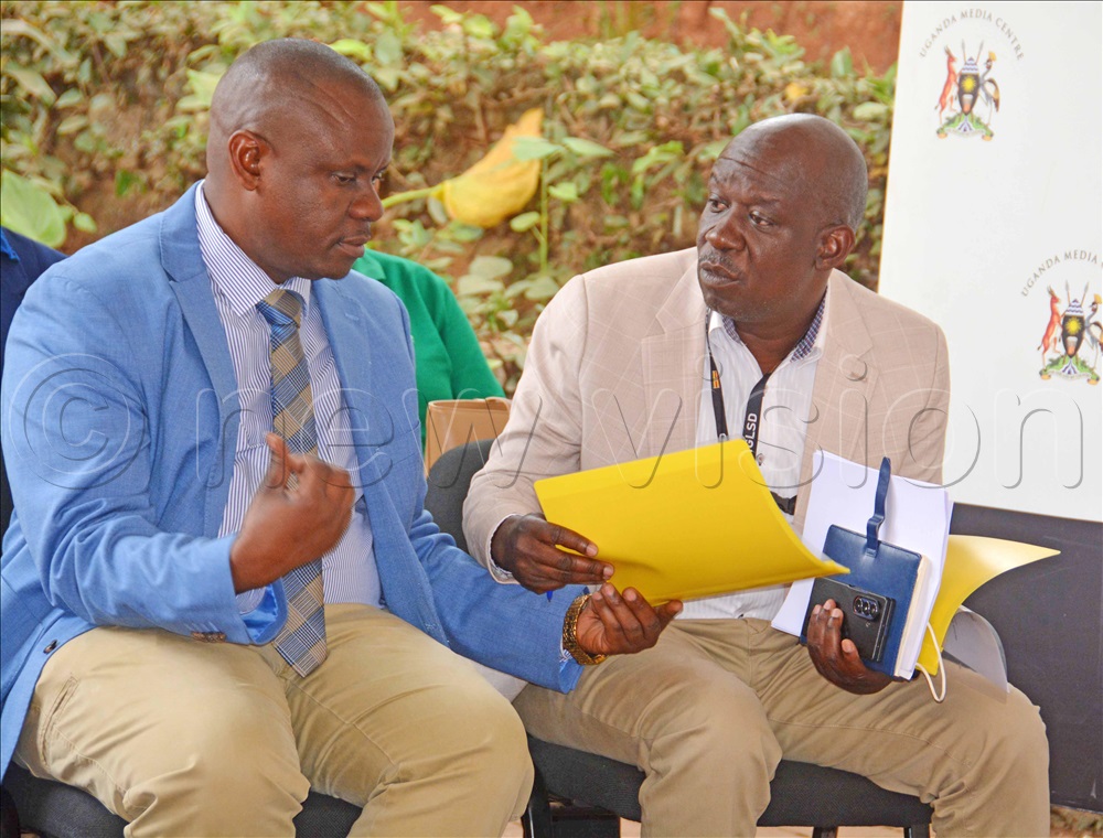 The state minister of youth and children affairs Balaam Barugahara (left) interacts with the Gender ministry official Meddie Kibirango during a press conference at Uganda Media Centre in Kampala on August 6, 2025. 