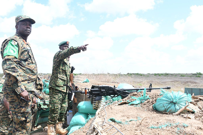 Maj. Akampuriri, commander Km-67, showing the hotspot direction of the enemy. (Courtesy)