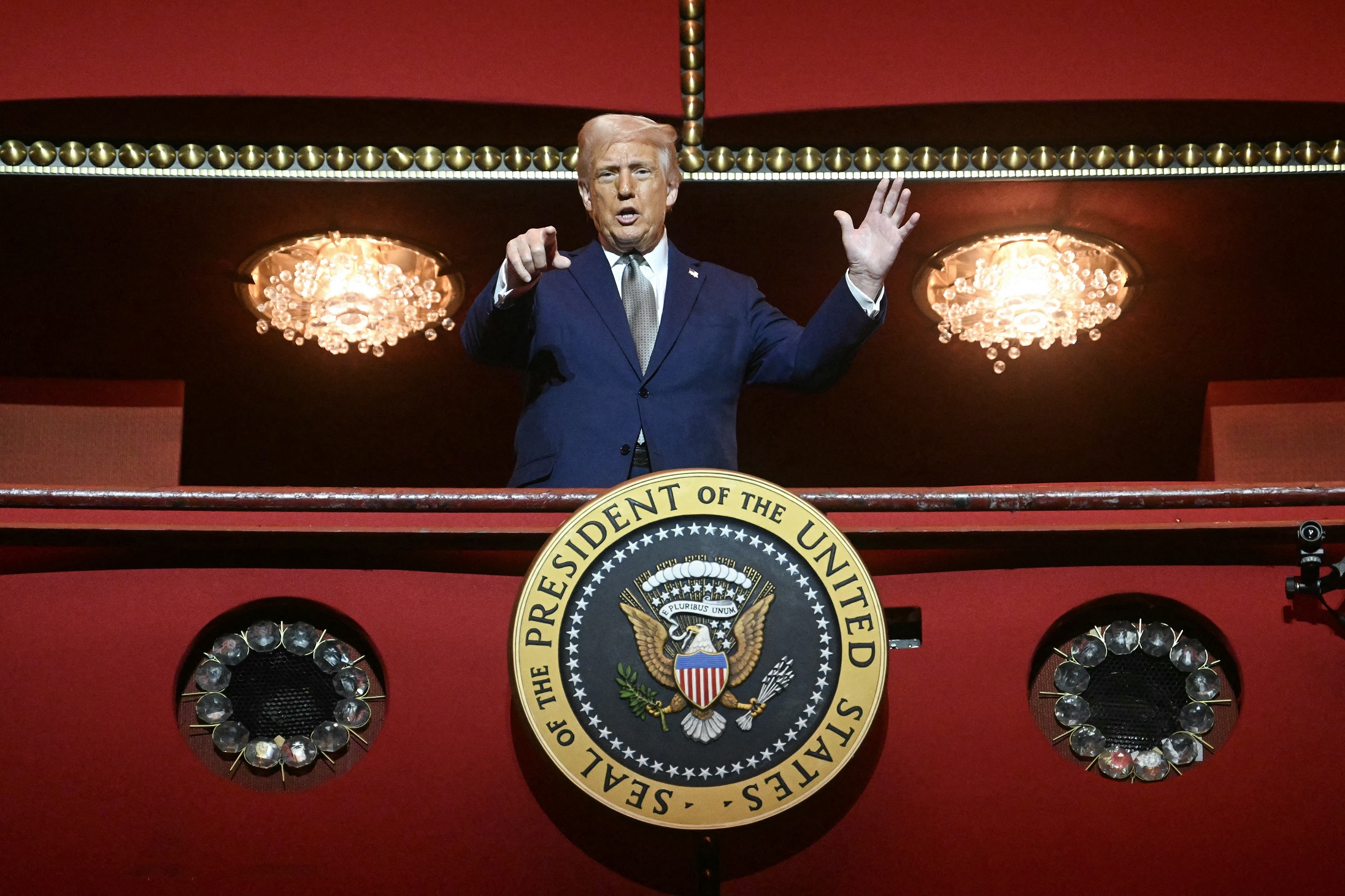 US President Donald Trump stands in the presidential box as he tours the John F. Kennedy Center for the Performing Arts in Washington, DC, on March 17, 2025. (AFP)