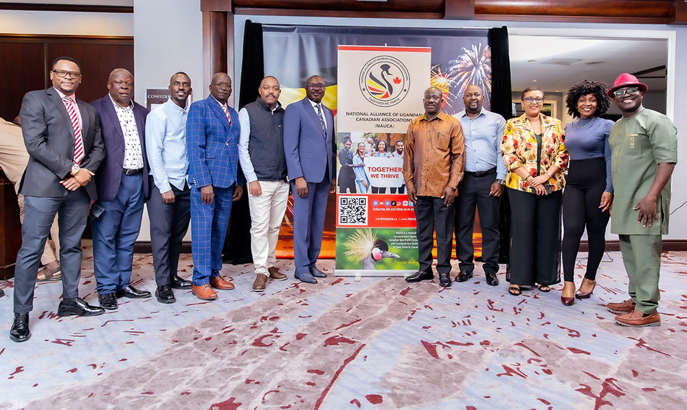 The head of the State House Diaspora Unit (R), Allan Kajik, the Acting High Commissioner of Uganda to Canada (2R), Deputy head of the Diaspora Unit, Henry Wabyona (L) and the chairperson of NAUCA, Justus Mirembe, and other members pose for a photo after the launch. (Credit: Uganda High Commission Canada)