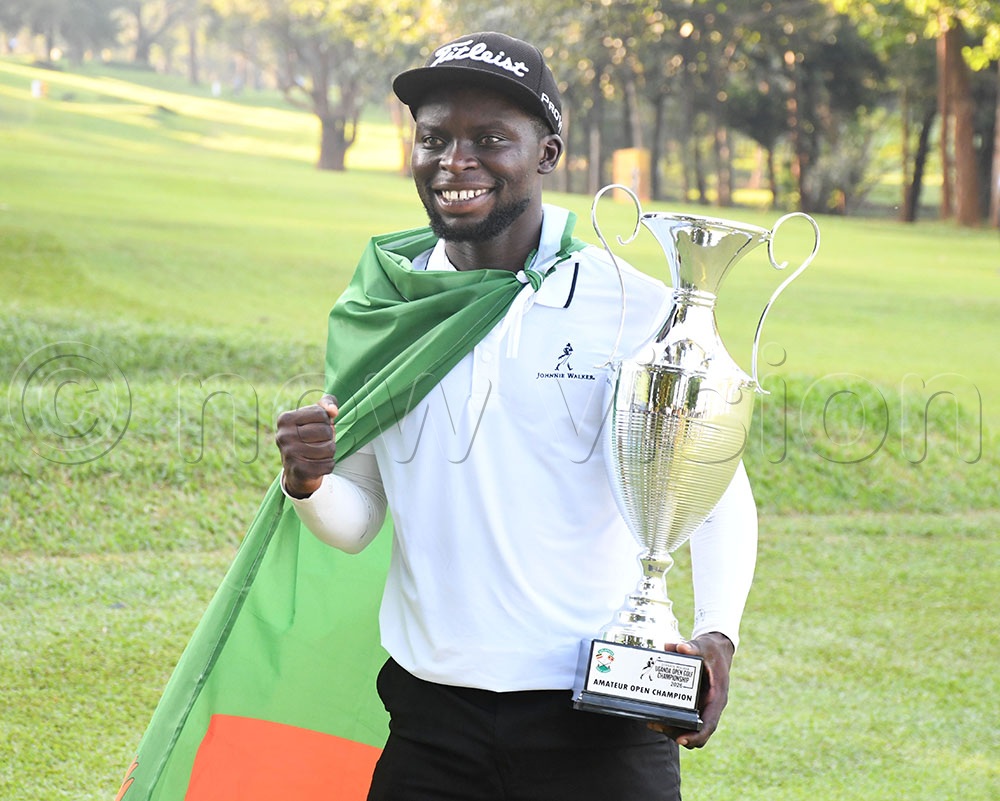 Dominic Musonda celebrates with the overall v trophy after he won the Uganda Open at Kitante on August 28, 2026. (Photo by Michael Nsubuga)