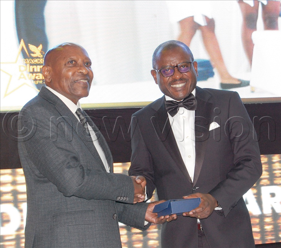 Prof. Frederick Ssempebwa giving an accolade to Justice Oscar Kihika.