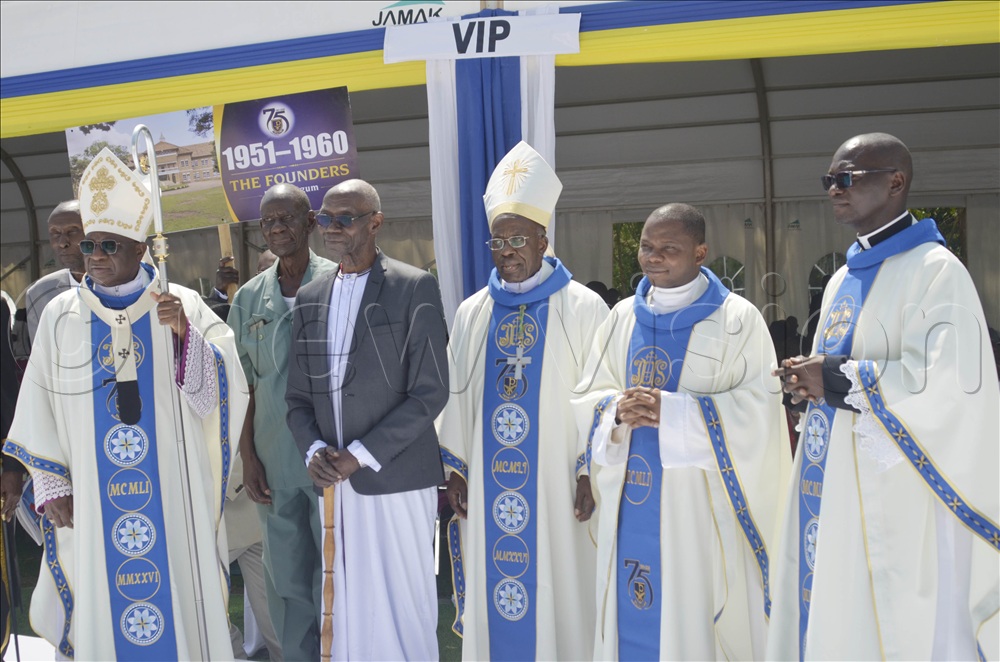Mzee Joseph Ssempiiri, the only survivor pioneer student (1950-1952) pose for a photo with the Archbishops and others Christians