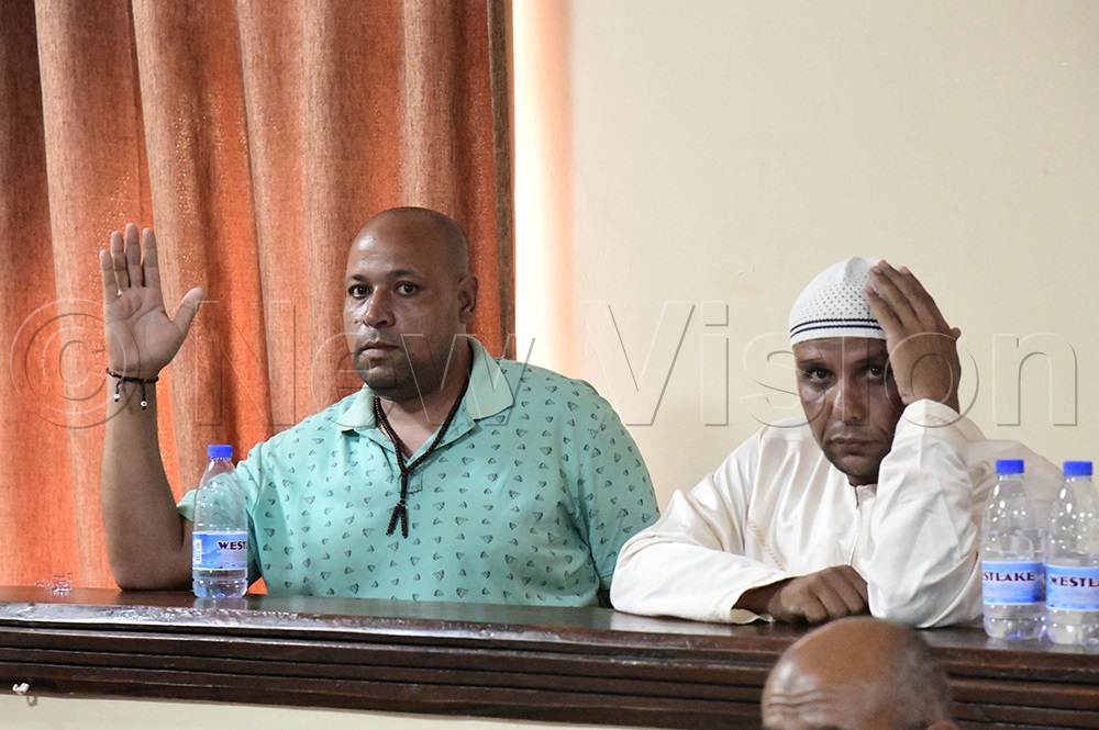 Nabil (raising his hand) and Fahim, who were sentenced to 22 years' imprisonment for the 2024 murder of Mahmoud Ahmed Zinhom Ibrahim Selim in Soroti City. (Credit: Godfrey Ojore)