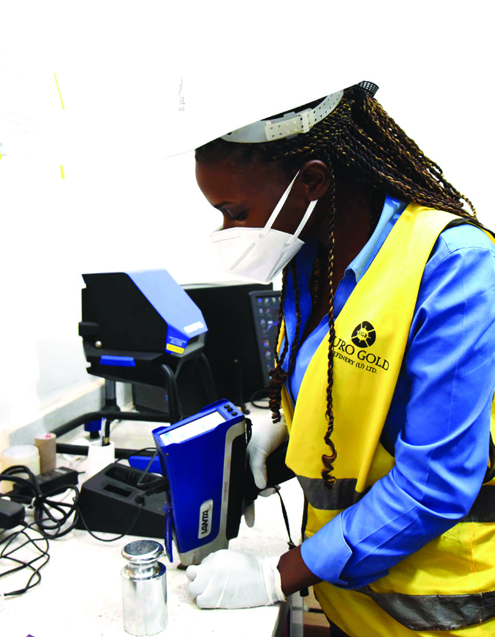 A lady testing mineral composition at the Euro Gold Refinery in Kamwokya, Kampala. (File)