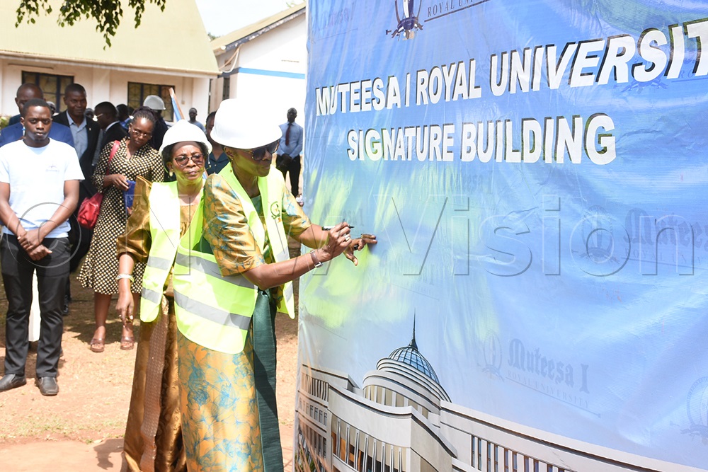 Princess Royal Agnes Nabaloga signs the proposal for the new complex at Muteesa I Royal University. (Credit: Dickson Kulumba)