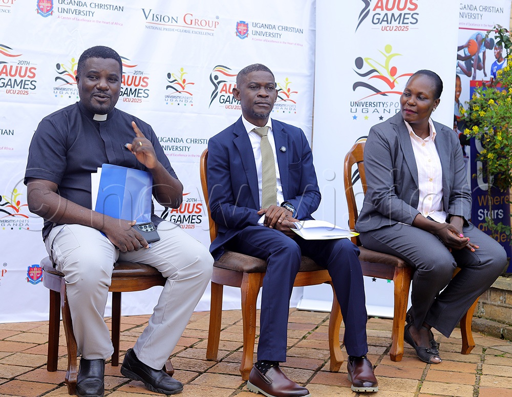 The UCU Deputy Vice Chancellor, Rev. Prof. John Kitayimbwa (L), address the media as AUUS president George Wagoogo (C) and vice president Martha Soigi look on at Uganda Christian University during the launch of the 20th Edition of the University Games on Tuesday, November 18, 2025. (Credit: Johnson Were)