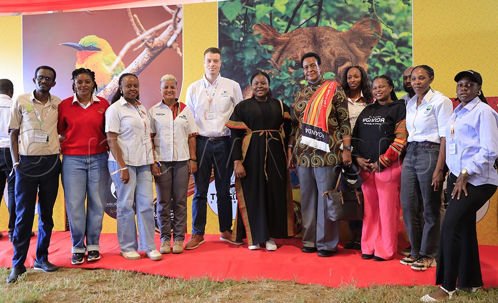 Ambassador Anne Katusiime (7th left), the Consul General of Uganda consulate in Arusha, Tanzania, having a photo moment with some of Uganda's private sector tourism stakeholders who participated in the Kilifair Tourism Expo. (Credit: Julius Luwemba)
