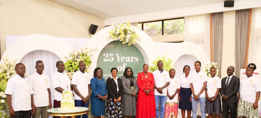Supreme Court Justice Catherine Bamugemereire poses for a group photo with participants at the event. (Courtesy)