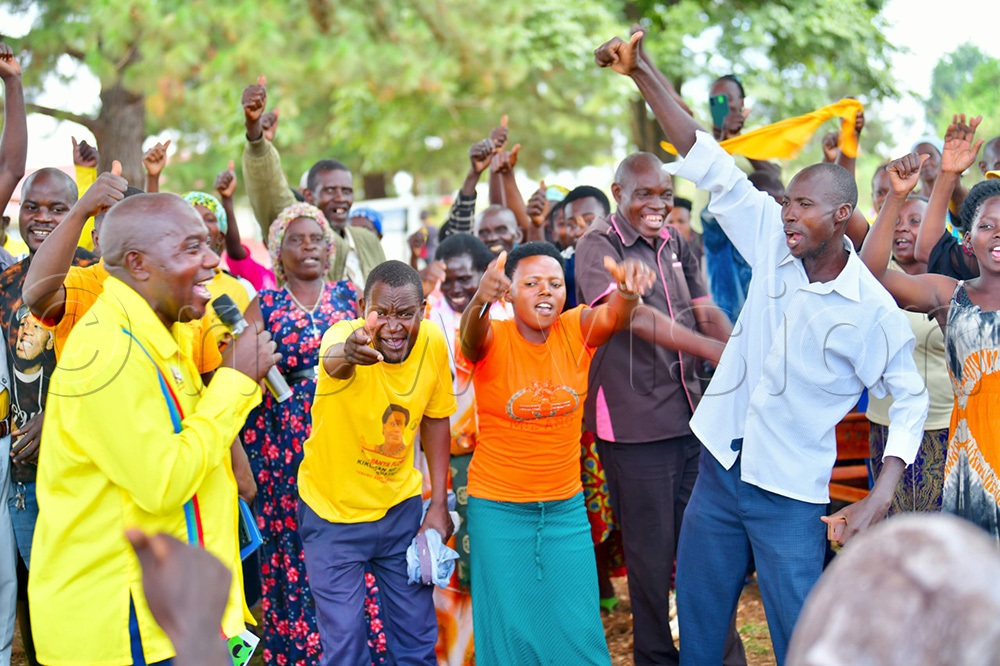 NRM village structure leaders cheering on while the National Resistance Movement (NRM) flagbearer Paddy Kisembo addressed them. (Photo by Peter Abaanabasazi)