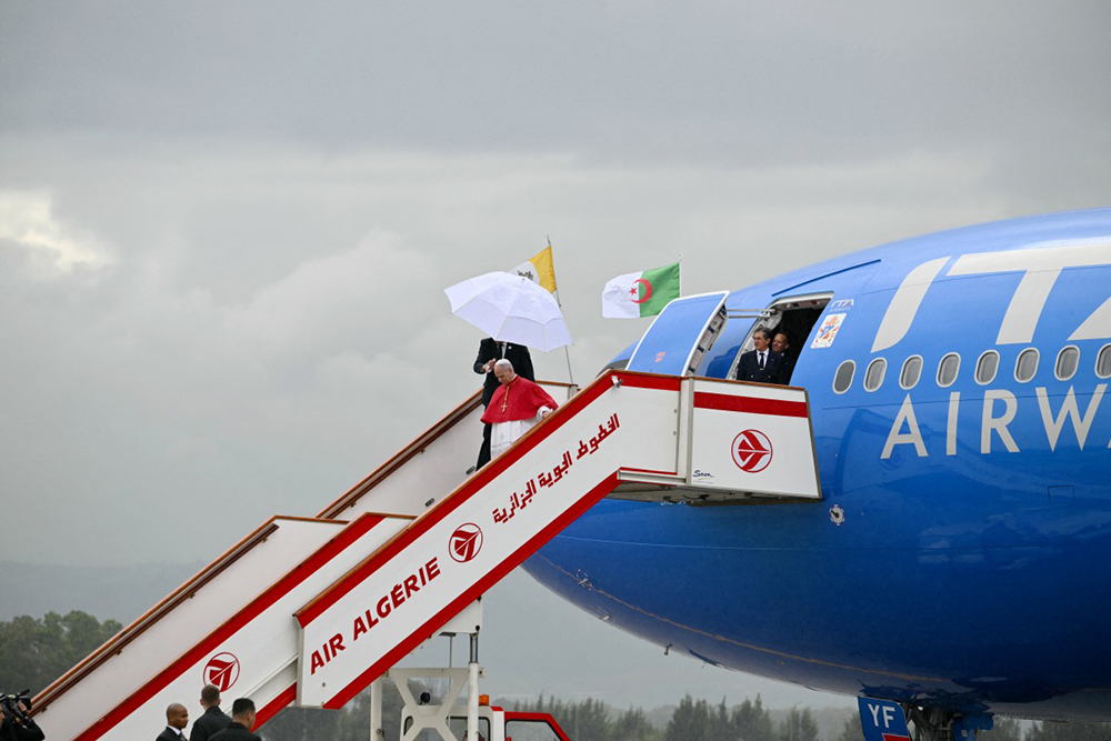 Pope Leo XIV disembarks from the plane after landing at the Houari Boumediene International Airport on April 13, 2026. (AFP)