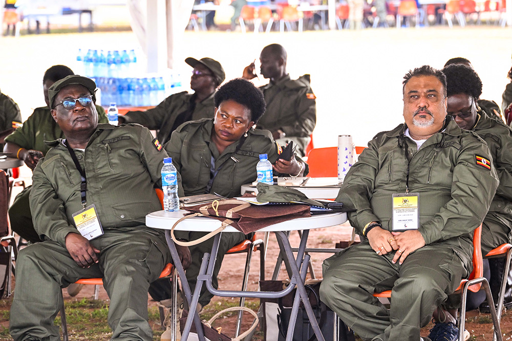 Attorney General Sam Mayanja (L), Trade, Industry and Cooperatives Minister Sanjay Tanna (R) and other cabinet ministers attending a retreat at Kyankwanzi on Monday. (PPU Photo)