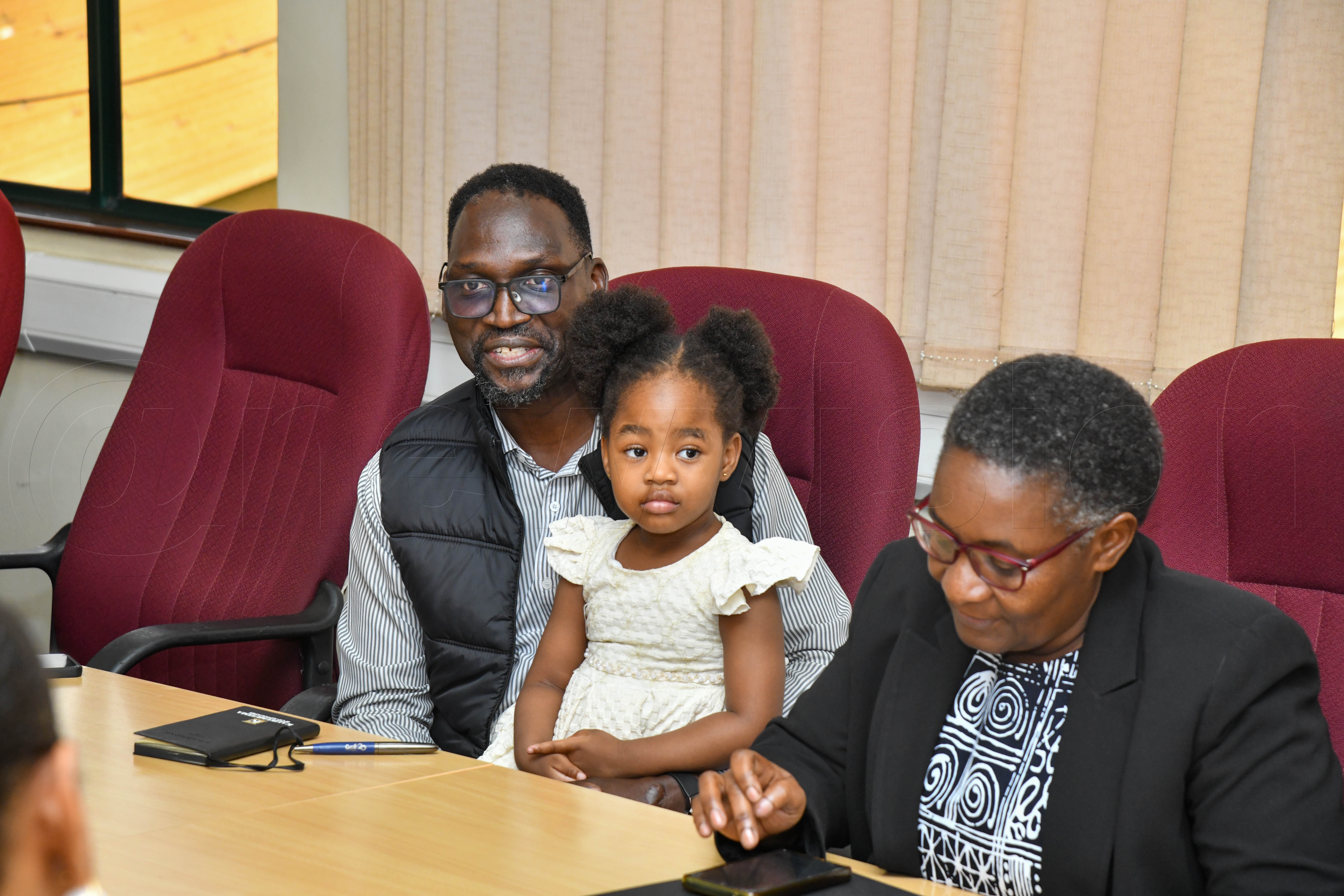 EIC Sidney Miria Babanga with the outgoing EIC Barbara Kaija