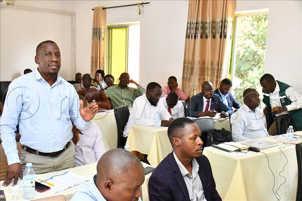 Jinja District Principal Environment Officer, Moses Maganda (L) outlining some of the challenges during the inception meeting for the Kalagala-Itanda Falls Conservation and Protection Project (KIFCP), hosted by the Ministry of Water and Environment at Bilkon Hotel in Jinja City on July 30.