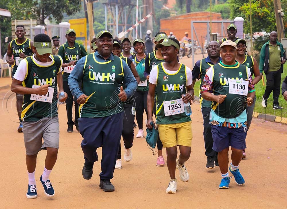 Dr James Musinguzi (2nd left) taking part in the 5 kilometre race during the Sunday marathon in Kampala. (Credit: Julius Luwemba)