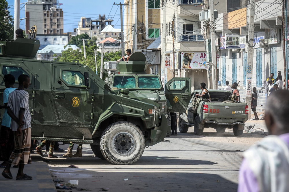 Somali government forces ride in armoured vehicles during a patrol as residents gather following reported shelling in the Howl Wadaag district of Mogadishu, on June 4, 2026. (AFP)
