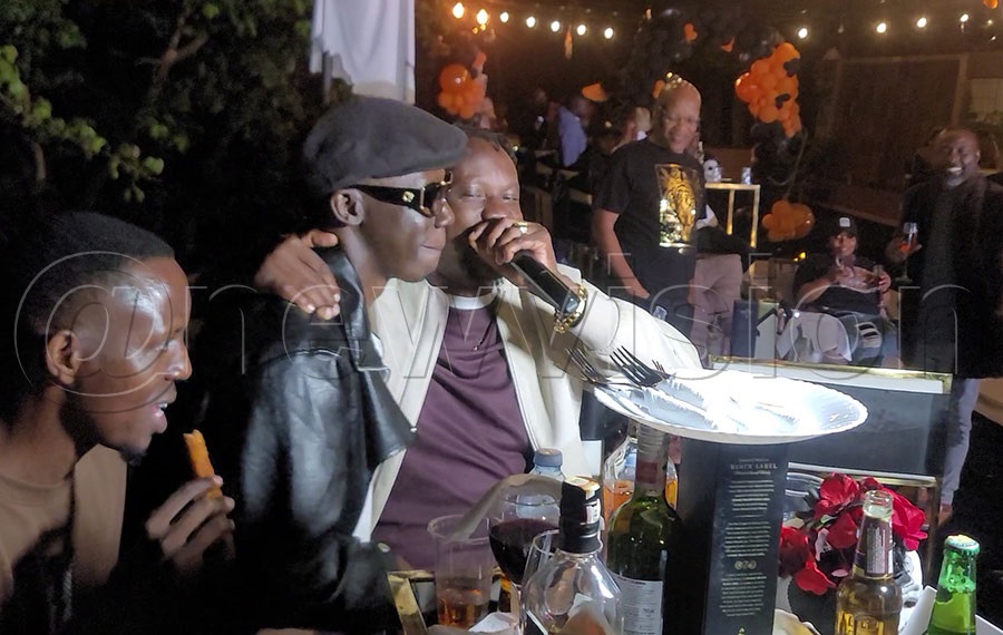 Douglas Lwanga with Peter Miles