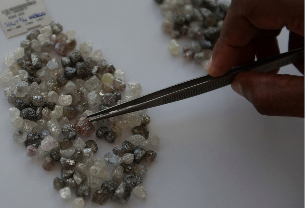 A picture taken at De Beers office in Gaborone shows diamonds from Botswana diamonds mines. (Photo by MONIRUL BHUIYAN / AFP)