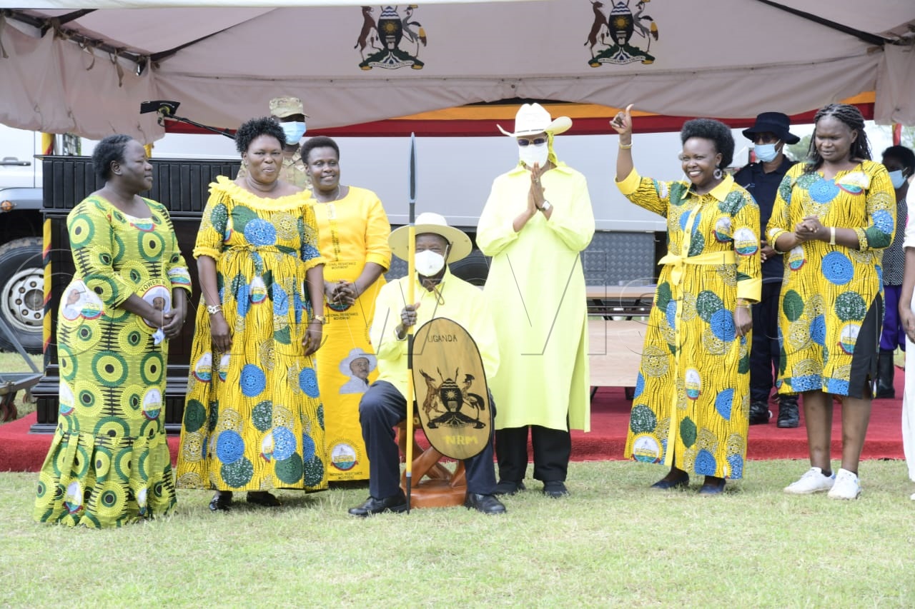 President seated with a shield and spear.