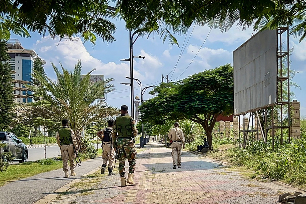 Members of the Tigray People's Liberation Front (TPLF) walk along a main road in Mekelle on September 23, 2026, as tensions intensify in northern Ethiopia after Tigrayan rebels seized control of airports in the region. (Credit: AFP)
