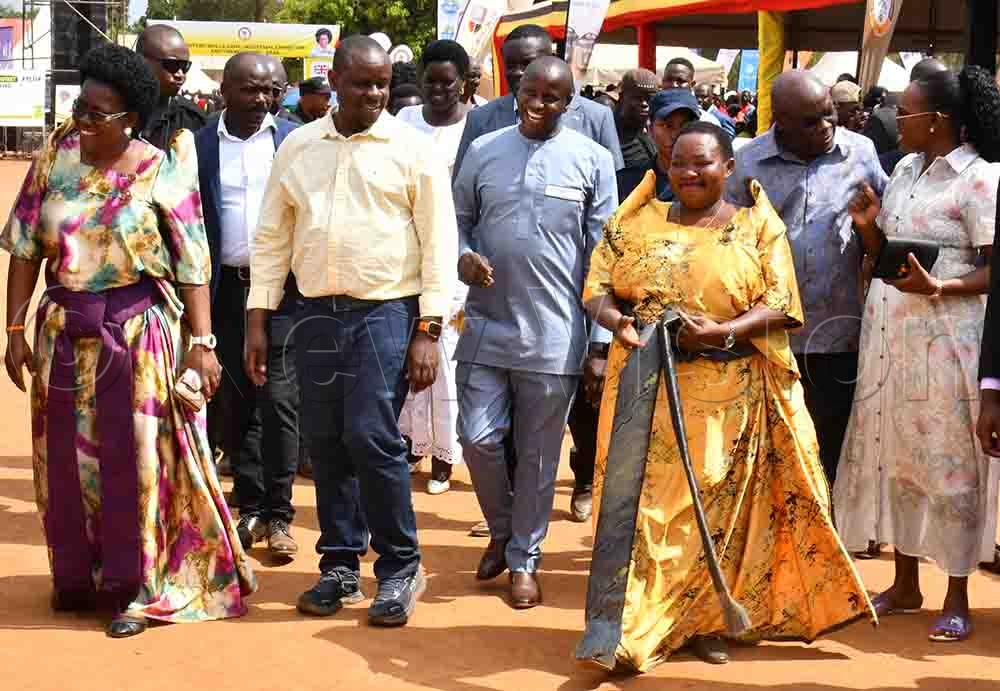 Local Government Minister Balaam Barugahara Ateenyi (2nd left), Prime Minister Robinah Nabbanja (2nd right) and Minister Phiona Nyamutoro (right) at Dr. Monica Musenero Masanza's thanksgiving ceremony at Petete Primary School playground in Butebo district on October 3rd. (Credit: Donald Kiirya)