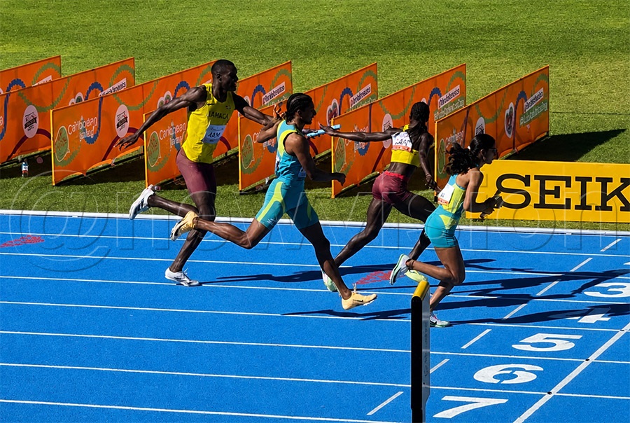 Haron Adoli passing on a baton to Shida Leni