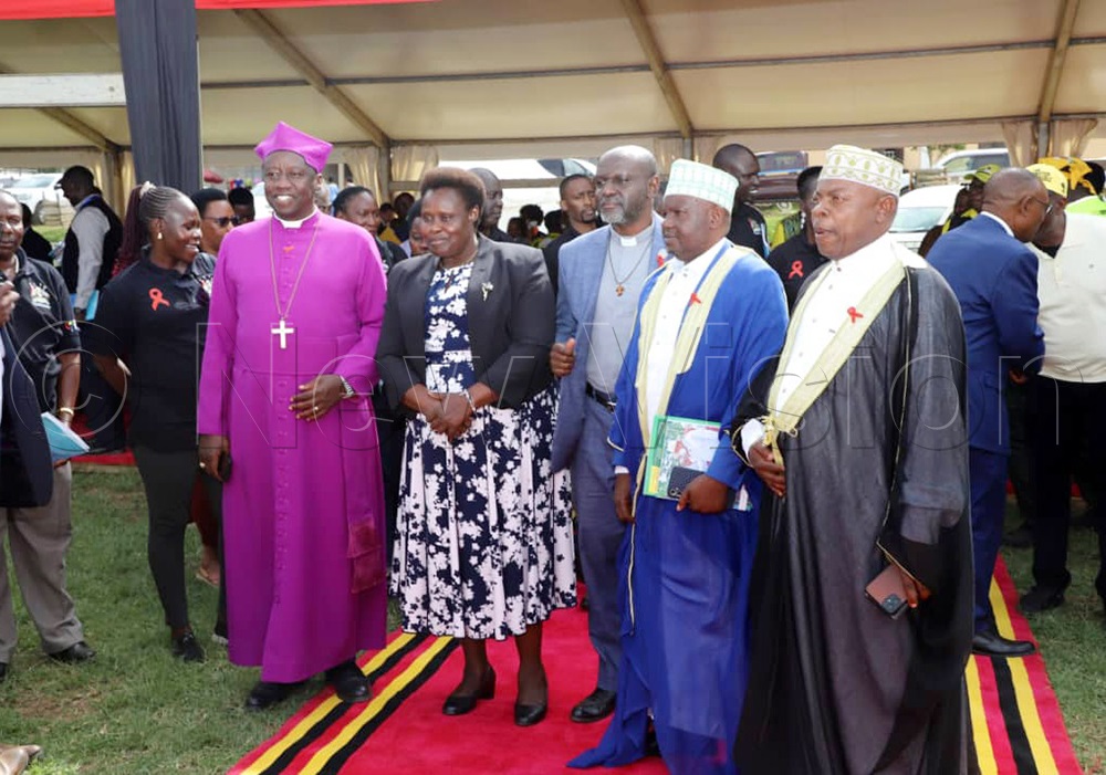 Bishop for West Ankole, Amos Twinomujuni, with other religious leaders, pose for a group photo with the Vice President Jessica Alupo during WAD commemorations in Kizinda town council in Bushenyi district on Monday. (Credit: Agnes Kyotalengerire)