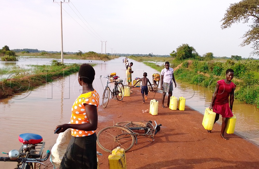 Sometimes a curse can turn into a blessing: Flooded roads become water sources for residents of Amolatar.