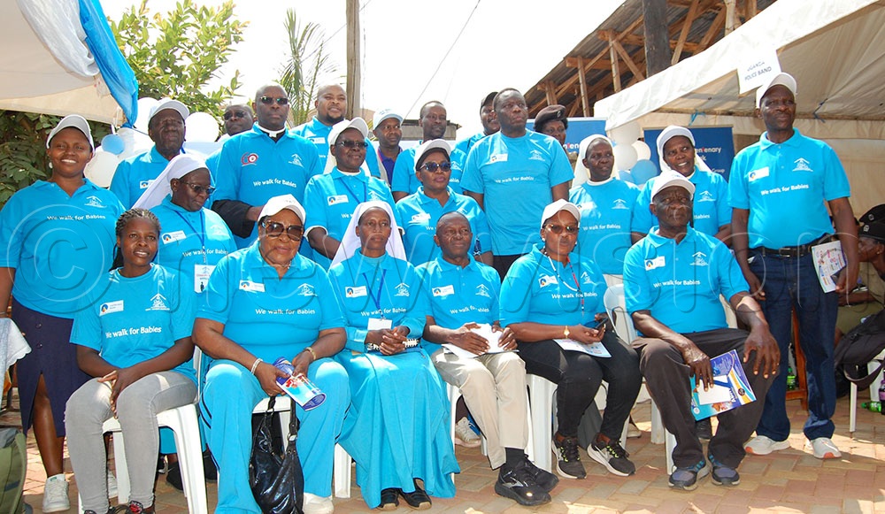 Nsambya Babies Home stakeholders and guests sharing a photo-moment at the conclusion of the fundraising charity walk at the facility in Nsambya, Makindye Division on Saturday, July 25, 2026. (Photo by Mathias Mazinga)
